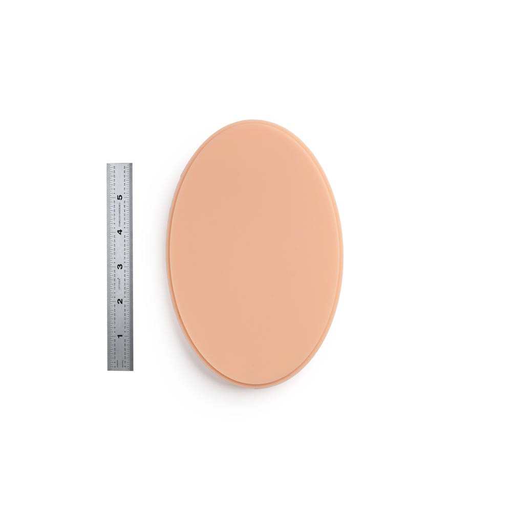 APOF Micro Series Small Oval in Fitzpatrick Tone 2 shown with ruler for scale