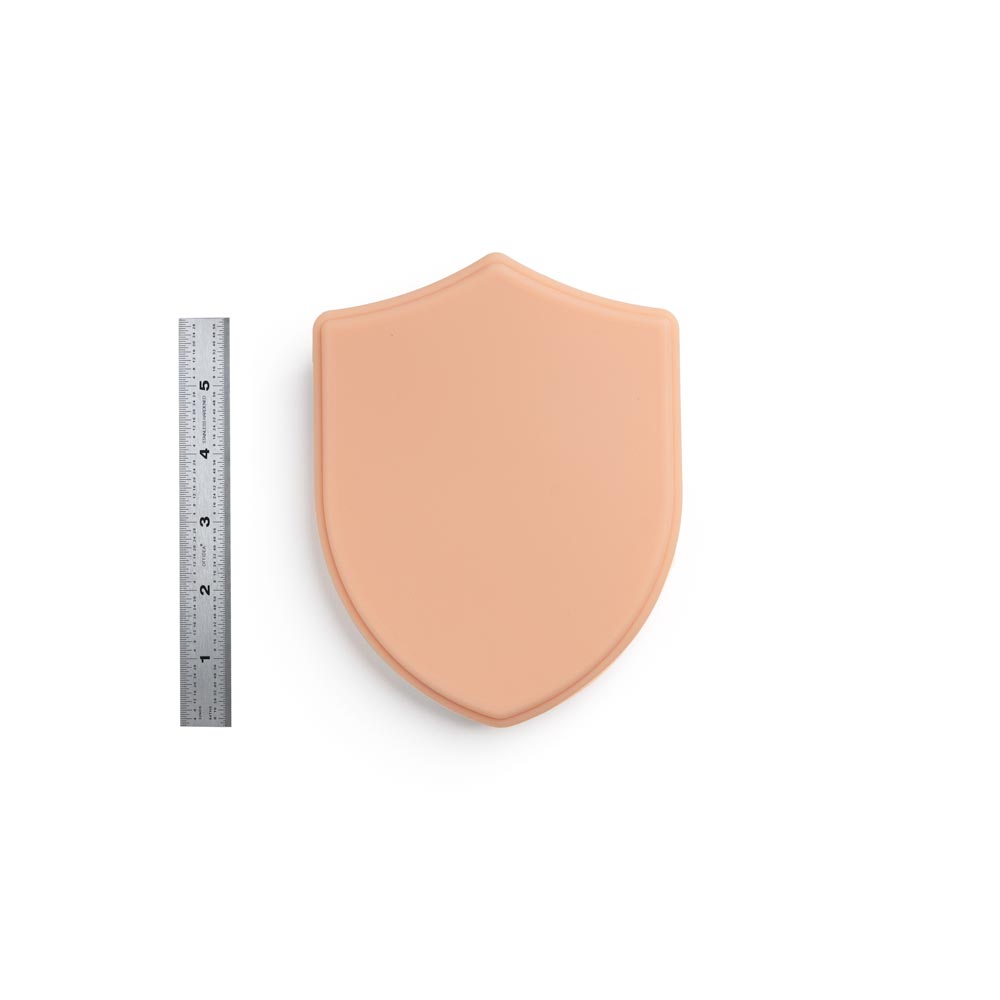 APOF Micro Series Shield in Fitzpatrick Tone 2 shown with ruler for scale