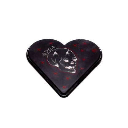 Example of black APOF Micro Heart canvas tattooed with white tattoo ink and red tattoo ink. Tattooed image shows white APOF letters, white skull, and red stars.